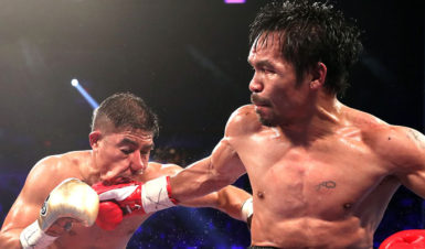 Manny Pacquiao catches Jesse Vargas flush with a right hand. (Photo courtesy of Fightnews website)