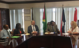 Minister of Public Security Khemraj Ramjattan (third, right) engages Coordinator of SEACOP Karen Clarke (second, right). Looking on are High Commissioner of the United Kingdom to Guyana Greg Quinn (right), EU Ambassador Jernej Videtic (fourth, left), Crime Chief Wendell Blanhum (left) and others.