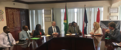 Minister of Public Security Khemraj Ramjattan (third, right) engages Coordinator of SEACOP Karen Clarke (second, right). Looking on are High Commissioner of the United Kingdom to Guyana Greg Quinn (right), EU Ambassador Jernej Videtic (fourth, left), Crime Chief Wendell Blanhum (left) and others.