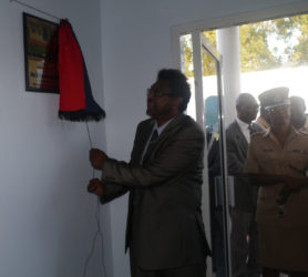 Minister of Public Security, Khemraj Ramjattan unveiling the plaque at the official opening of the Seelall Persaud Fitness Centre yesterday.