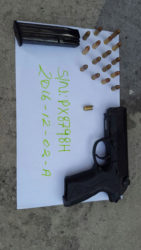 The Baretta pistol with the live rounds and the spent shell that were recovered