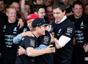 Japanese Grand Prix - 9/10/16. Mercedes’ driver Nico Rosberg of Germany celebrates with Mercedes’ nonexecutive chairman Niki Lauda and team principal Toto Wolff after they won the Constructors’ Championship title for the 2016 season... (REUTERS/Toru Hanai)    