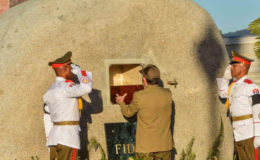 Raul Castro interring his brother’s remains  