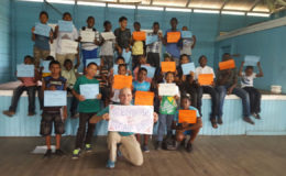 Anthony Skow (foreground), Peace Corps Volunteer attached to the Bagotville Primary poses with the participants (Rotary Club of Stabroek photo)
