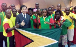 The successful Guyana amateur boxing team outfit poses with president of AIBA Dr. Ching-Kuo Wu. 