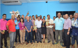 Mr. Roy Prasad and Massy Group Country Manager Mr. Deo Persaud pose with the winners of both tournaments.