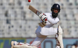 England’s Moeen Ali sweeps on his way to his fifth test century against India at the  M A Chidambaram Stadium, Chennai, India. REUTERS/Danish Siddiqui