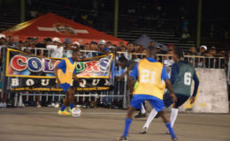 On the hunt! Devon Millington (left) of Sparta Boss initiating an attacking play while being watched closely by Rafael Edwards of Tucville (partially hidden) during the final of  the Guinness ‘Greatest of the Streets’ Georgetown Zone at the National Park Tarmac Friday night.