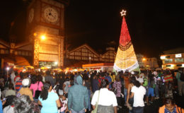 City Hall’s Christmas tree displaying the flag colours on Friday in Stabroek Square. (Keno George photo)
