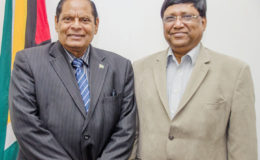 Prime Minister Moses Nagamootoo (left) and Dr. V.R.S. Sampath
