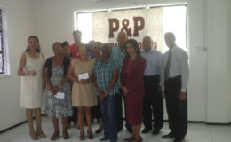 P&P representatives with recipients of donations
