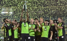 Andre Russell holds the BBL title aloft after Sydney Thunder won their first title last season.