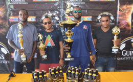 The top four finishers [Tucville (2nd), Broad Street (4th), Sparta Boss (champion) and Back Circle (3rd)] in the Guinness ‘Greatest of the Streets’ Georgetown Leg displaying their respective accolades in the presence of Banks DIH Limited executives, Director of Sports Christopher Jones and Colours Boutique Staffer Creanna Damon 