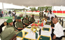 President David Granger (right) sharing  a light moment with some of the officers of the GDF as Chief of Staff, Brigadier George Lewis (next to the President) looks on. The President today served Christmas lunch to soldiers at the GDF at Camp Ayanganna. (Ministry of the Presidency photo