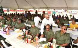 Commander-in-Chief of the Armed Forces, President David Granger serving lunch to some of the ranks who are stationed at the Base Camp Ayanganna. (Ministry of the Presidency photo)
