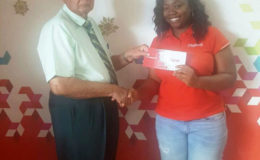 Louanna Abrams handing over the sponsorship cheque to Justice Kennard, organizer of the 2016 edition of the Annual Kennard’s Memorial Turf Club  Boxing Day horse race meet. 
