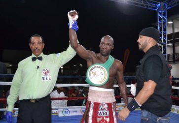 Eion Jardine (left) announces the winner after a bout he refereed.