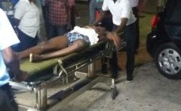 Matthew Scott being taken into the Accident and Emergency Department of the Georgetown Public Hospital 