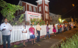The PPP/C-led candlelight vigil outside Red House last evening prior to a counter-demonstration led by Minister of Social Protection Volda Lawrence. (Keno George photo)