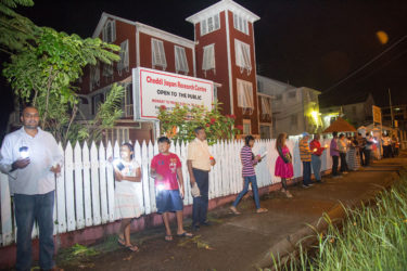 The PPP/C-led candlelight vigil outside Red House last evening prior to a counter-demonstration led by Minister of Social Protection Volda Lawrence. (Keno George photo)