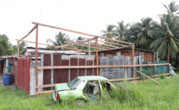 The nearby structure that was dismantled by its owner. The city workers, however, did not pay any attention to the wrecked car (forefront) which is also an encumbrance. (Photo by Keno George)