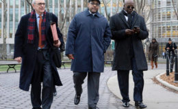 New York state Sen. John Sampson, center, was sentenced for obstruction of justice and lying to the FBI. (Jefferson Siegel/New York Daily News)
