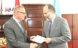 Ambassador Jules Bijl presenting his letters of credence to CARICOM Secretary-General, Ambassador Irwin LaRocque (CARICOM photo)

