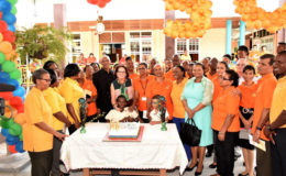 President David Granger, First Lady,  Sandra Granger and Minister of Public Health,  Volda Lawrence with the Executive members, staff and children of the Ptolemy Reid Rehabilitation Centre during the celebration.  (Ministry of the Presidency photo)