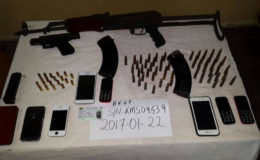 The AK-47, ammo and other items recovered (Police photo)