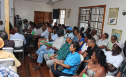 Part of the crowd which engaged GRA Commissioner-General Godfrey Statia on Tuesday at the GGDMA headquarters. (Photo by Keno George)
