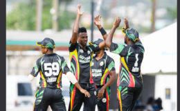 Ronsford Beaton celebrates taking a wicket with teammates during the third round match between Combined Campuses & Colleges Marooners and Guyana Jaguars in Group “B” of the Regional Super50 Tournament yesterday at the Kensington Oval. Photo by WICB Media/Randy Brooks of Brooks Latouche Photography 