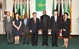 President David Granger (third from right), newly accredited Chinese Ambassador,  Cui Jianchun (centre), acting Prime Minister and Minister of Foreign Affairs,  Carl Greenidge, (fifth from right) and Director General of the Ministry of Foreign Affairs,  Audrey Waddell (right).  The Ambassador presented his letters of credence at State House yesterday. (Ministry of the Presidency photo)