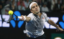 Switzerland’s Roger Federer hits a shot during his match against Switzerland’s Stan Wawrinka. (REUTERS/Thomas Peter) 