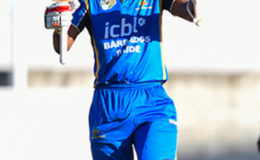 Kraigg Brathwaite celebrates his maiden hundred during the first round match between Barbados Pride and Guyana Jaguars in Group “B” of the Regional Super50 Tournament yesterday at Kensington Oval.
 Photo by WICB Media/Randy Brooks of Brooks Latouche Photography