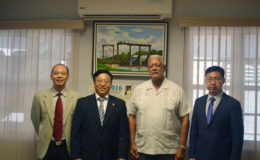 Minister of Agriculture Noel Holder (second from right) with new Chinese Ambassador to Guyana, Cui Jianchun (third from left) and Political Counsellor,  Yang Chengi (left) and Commercial Counsellor, Shen Hui Yong. (Ministry of Agriculture photo)

