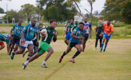 Rugby action in the President’s versus Vice President’s match on Saturday at the National Park (See page 28)