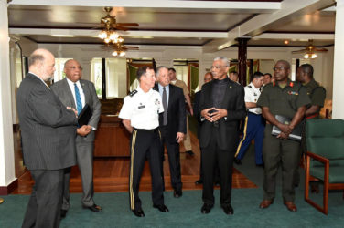 President David Granger (second from right) speaking with Lieutenant General Joseph DiSalvo. Also in photo at right is new Chief of Staff of the Guyana Defence Force, Brigadier Patrick West. At left is US Ambassador to Guyana, Perry Holloway and second from left is Minister of Natural Resources, Raphael Trotman. (Ministry of the Presidency photo)