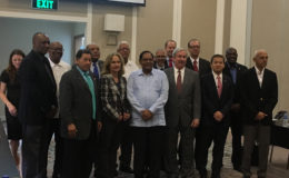 Prime Minister Moses Nagamootoo (centre in shirt-jac) along with other Ministers from the government and representatives from ExxonMobil. 