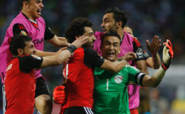 Egypt’s Essam El-Hadary (# 1) celebrates with team mates after the game (Amr Abdallah Dalsh/REUTERS)
