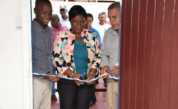 Director General of Maritime Administration Department (MARAD) Claudette Rogers cutting the ribbon at the commissioning of the MARAD safety office. From left are  Mayor of Bartica Gifford Marshall and Regional Chairman (Region 7) Gordon Bradford. (GINA photo)
