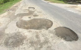 Several large potholes on the main road near to Fourth Bridge, where there is usually a large buildup of traffic.
