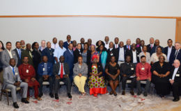 Some of the religious leaders with Director of the PANCAP Coordinating Unit Dereck Springer (left, standing), facilitators and UNAIDS representatives. Stooping at right is Roman Catholic Bishop in Guyana Francis Alleyne.