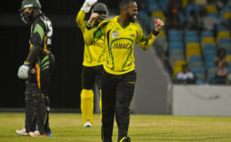 John Campbell celebrates one of his four wickets against Guyana Jaguars on Tuesday night.