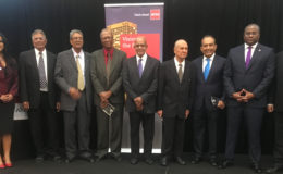 The longstanding members of the ACCA, including Maurice Solomon (fourth from left) and Yesu Persaud (fourth from right) along with Komal Samaroo (right) and ACCA Caribbean Head Orin Gordon (second from right). 