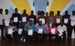 The newly certified IAAF Level-1 coaches pose for a photo opportunity following the graduation ceremony Saturday night at the YMCA.