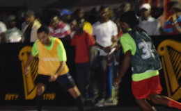 ESPN’s Duncan Saul (left) initiating a counterattack while being pursued by a Harmony Ballers player during their matchup in the Guinness ‘Greatest of the Streets’ West Demerara/East Bank Demerara zone at the Pouderoyen Tarmac.