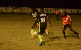 Part of the action between Mahaica Determinators (black) and Camptown (orange) at the Victoria Ground in the Petra Organization/Limacol Football Championship.