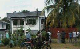 Shereffudeen Nazamudeen on top of the house during his bid to escape his attackers.