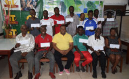 Representatives of the participating teams in the Limacol Football Championship displaying their group prize incentives in the presence of Petra Organization Co-Director Troy Mendonca (sitting 3rd from left) at the Brandsville Hotel