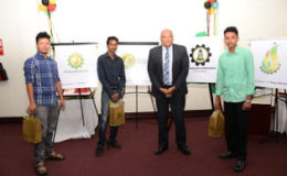 Minister of Natural Resources Raphael Trotman (second from right) with the three winning competitors (from left to right) Andre Jacobus, Albert Narine, and Noel Sukhai (GINA photo)